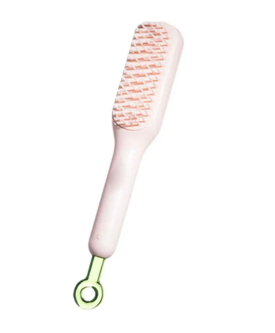 Brosse à cheveux autonettoyante