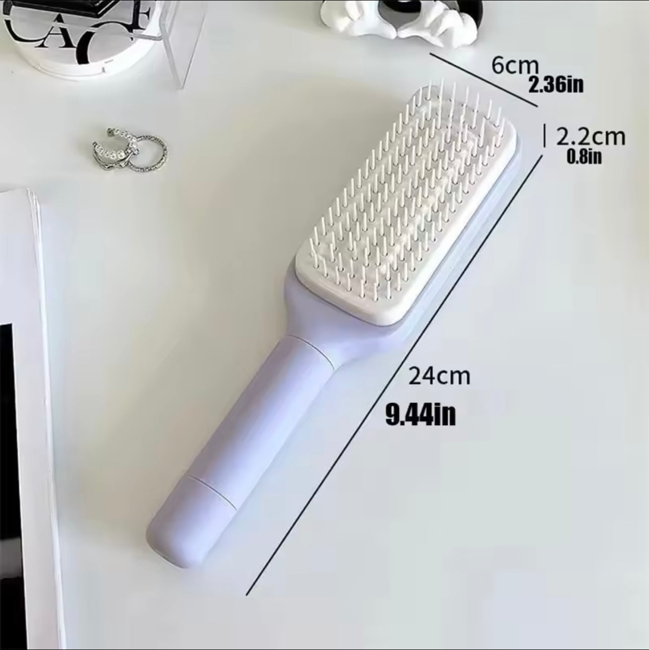 Brosse à cheveux autonettoyante